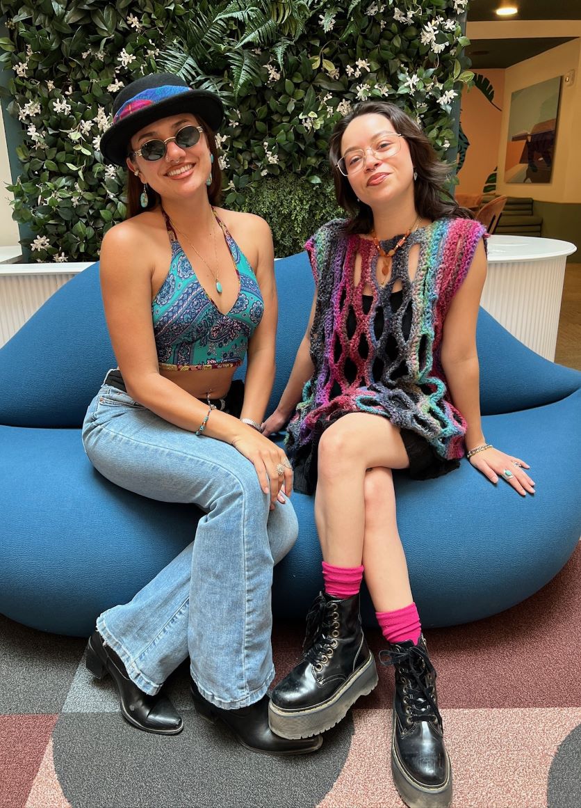Buffalo Exchange employees sitting on blue sofa