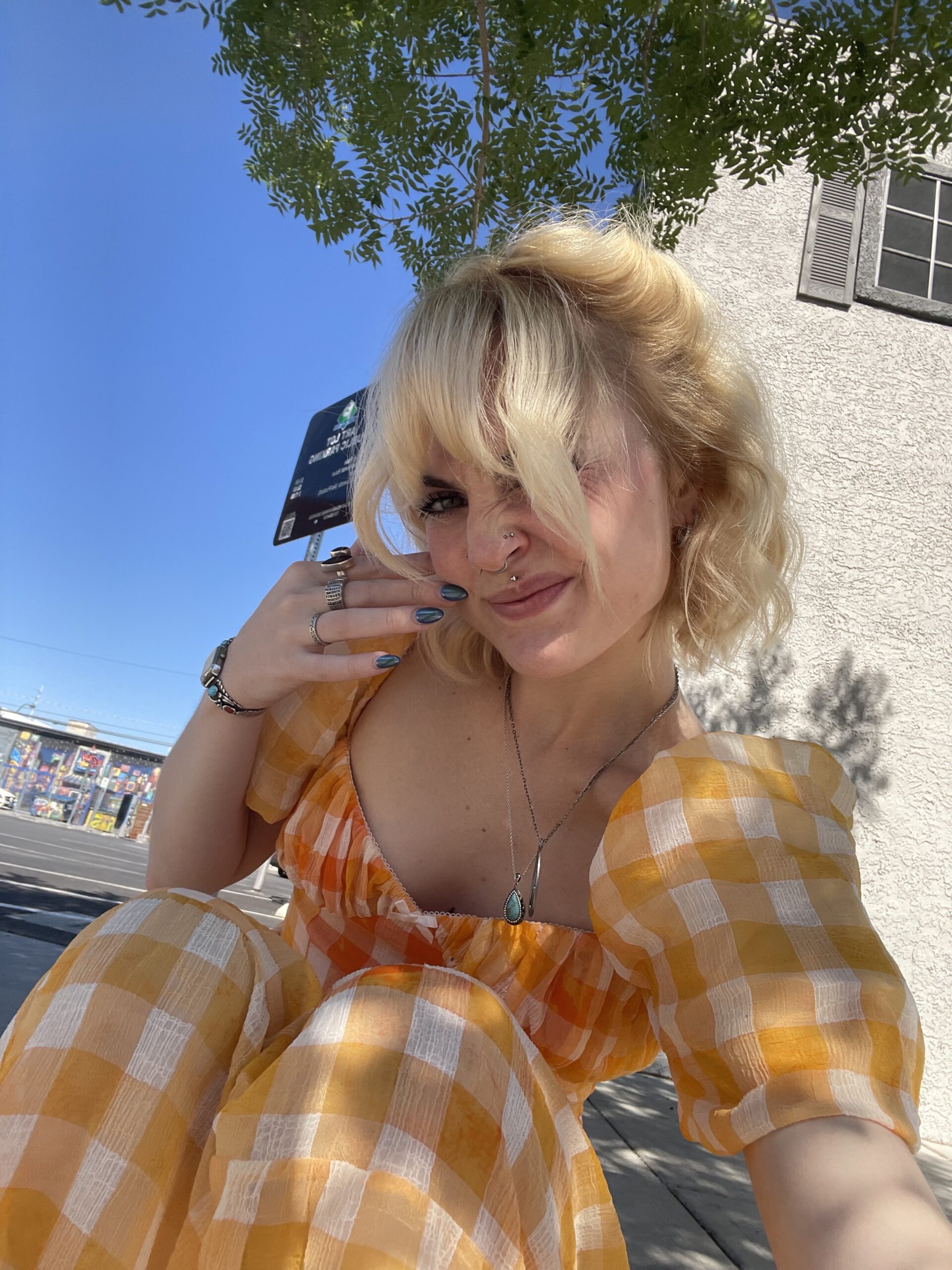 Employee Chloe posing outside in the sun